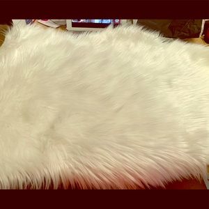 White bear skin shaped faux fur rug